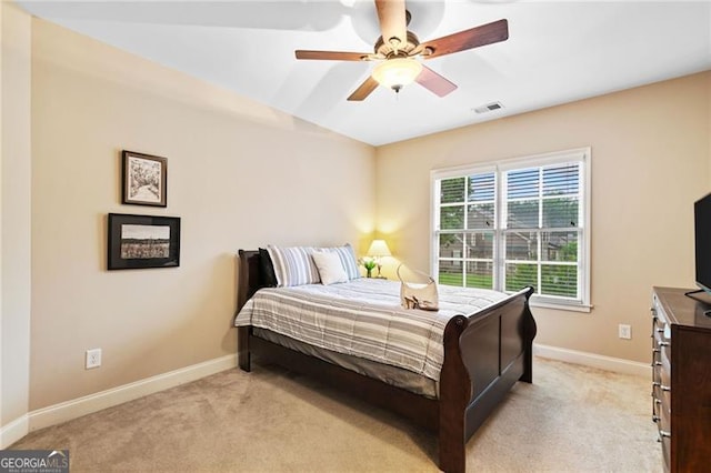 910 Ovalene Ln SW, Marietta, GA 30064 - bedroom featuring light colored carpet, baseboards, and a ceiling fan
