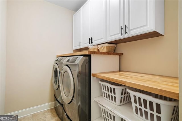 910 Ovalene Ln SW, Marietta, GA 30064 - washroom featuring washing machine and dryer, cabinet space, and baseboards