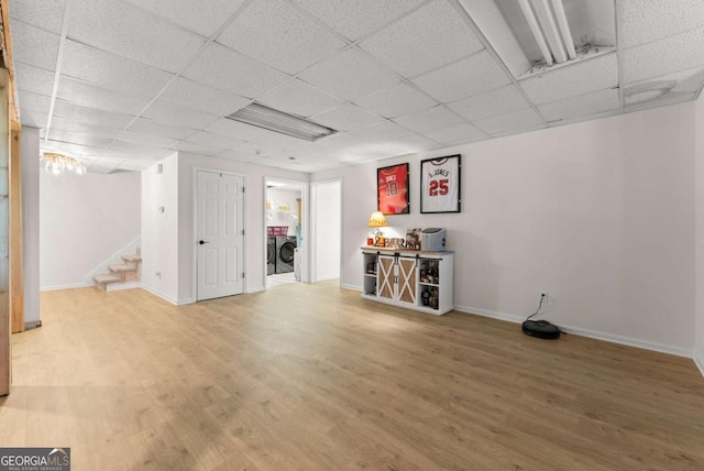 3652 Shady Oak Trl, Gainesville, GA 30506 - finished below grade area with a paneled ceiling, stairs, wood finished floors, and separate washer and dryer