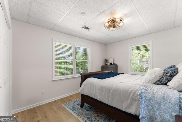 3652 Shady Oak Trl, Gainesville, GA 30506 - bedroom featuring a paneled ceiling, wood finished floors, and multiple windows