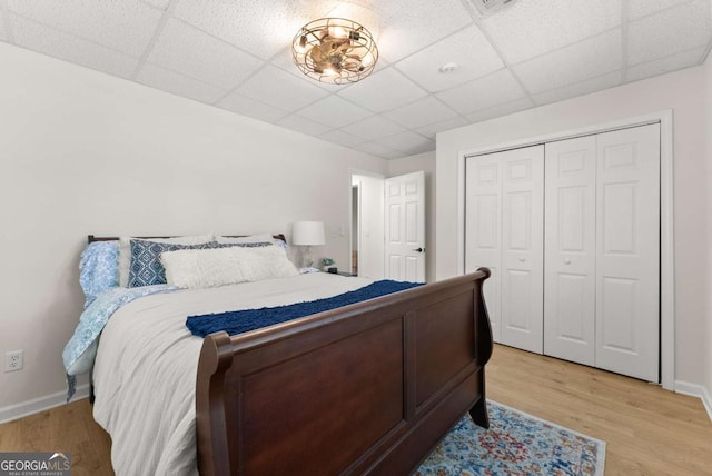 3652 Shady Oak Trl, Gainesville, GA 30506 - bedroom with a paneled ceiling, light wood-style flooring, and a closet