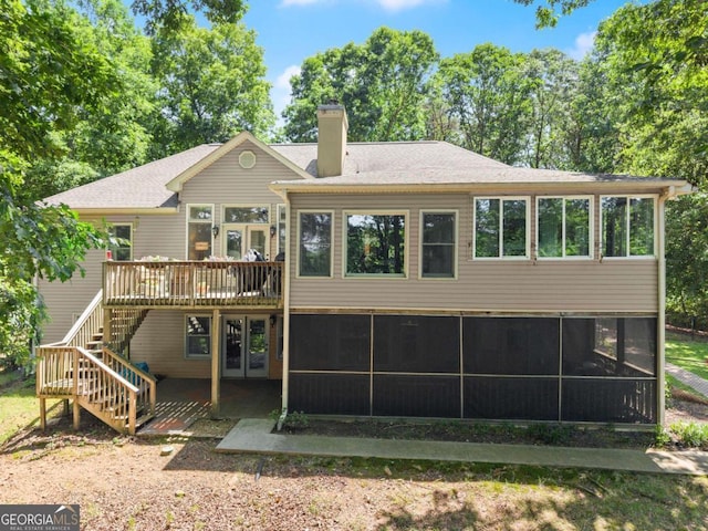 3652 Shady Oak Trl, Gainesville, GA 30506 - rear view of house featuring a sunroom, a chimney, stairway, and a deck