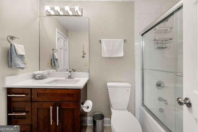 9701 Buice Rd, Alpharetta, GA 30022 - full bathroom featuring toilet, vanity, and shower / bath combination with glass door