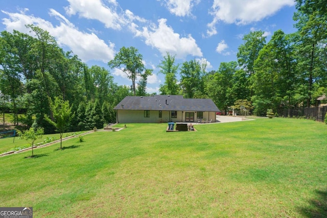 9701 Buice Rd, Alpharetta, GA 30022 - back of property with a patio area
