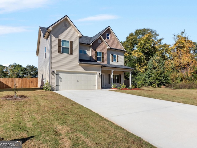 407 Rippling Water Way, Perry, GA 31069 - view of front of home featuring driveway, an attached garage, and a porch