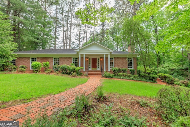302 Brookwood Ln, Lafayette, GA 30728 - neoclassical home featuring brick siding, a front lawn, and a chimney