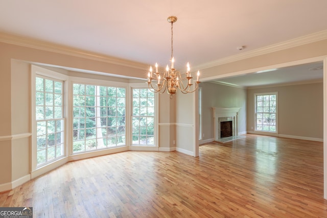 302 Brookwood Ln, Lafayette, GA 30728 - unfurnished living room featuring a chandelier, light wood-style floors, crown molding, and baseboards