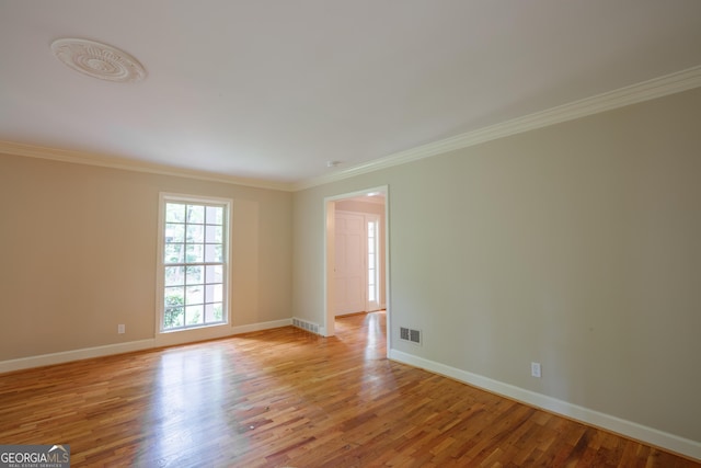 302 Brookwood Ln, Lafayette, GA 30728 - spare room with crown molding, light wood-style floors, and baseboards