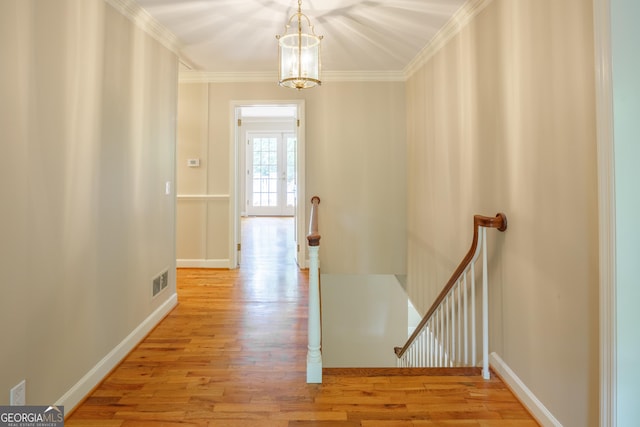 302 Brookwood Ln, Lafayette, GA 30728 - hall featuring an upstairs landing, light wood-style flooring, a chandelier, ornamental molding, and baseboards