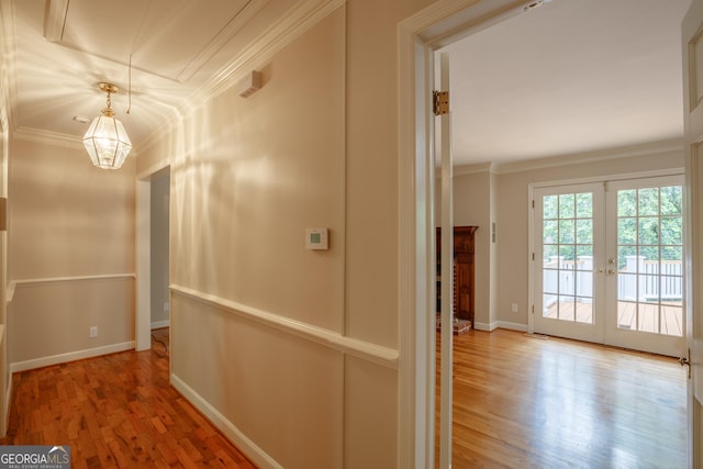 302 Brookwood Ln, Lafayette, GA 30728 - hallway with wood finished floors, ornamental molding, a chandelier, baseboards, and french doors