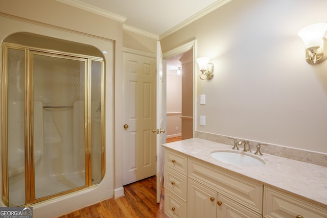 302 Brookwood Ln, Lafayette, GA 30728 - bathroom with a stall shower, crown molding, vanity, and wood finished floors