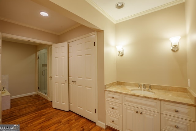 302 Brookwood Ln, Lafayette, GA 30728 - bathroom featuring wood finished floors, vanity, a shower stall, crown molding, and a bathtub