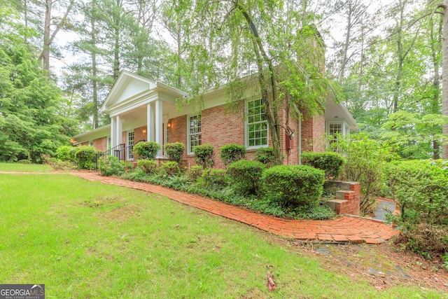 302 Brookwood Ln, Lafayette, GA 30728 - view of side of property featuring brick siding, a yard, and covered porch