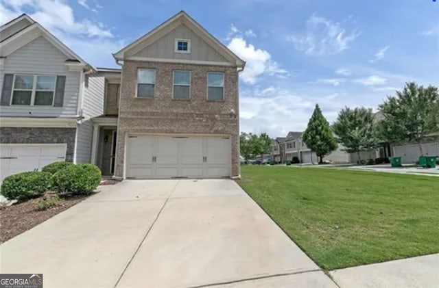3137 Spicy Cedar Ln, Lithonia, GA 30038 - view of front of house featuring driveway, brick siding, a front lawn, a garage, and board and batten siding