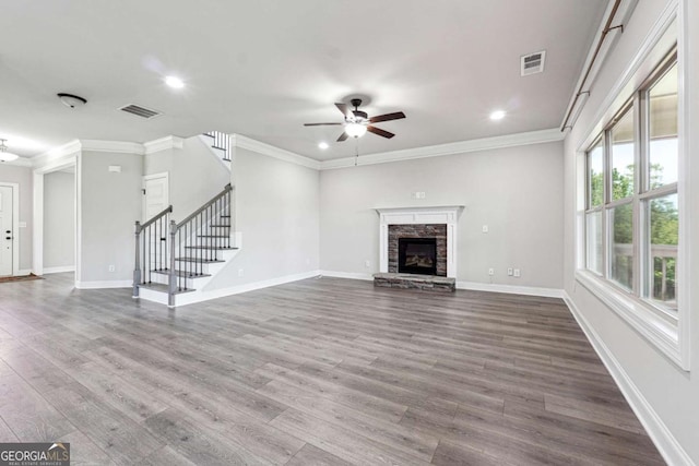 1824 Alberta Ln, Winder, GA 30680 - unfurnished living room featuring ceiling fan, stairway, dark wood-style floors, recessed lighting, and ornamental molding