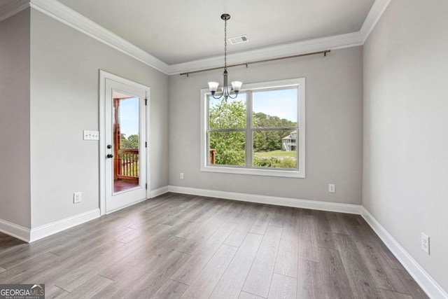 1824 Alberta Ln, Winder, GA 30680 - empty room with a chandelier, crown molding, wood finished floors, and baseboards