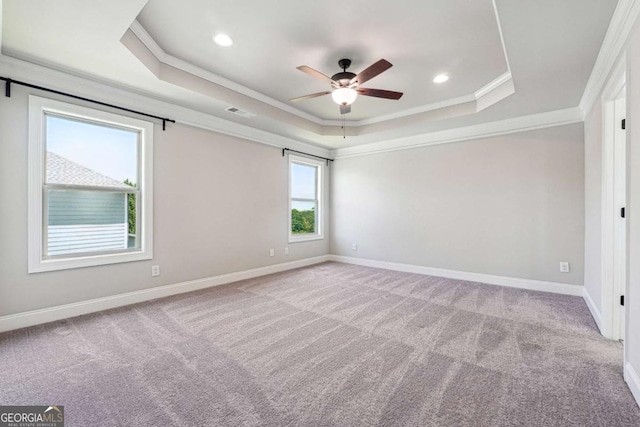 1824 Alberta Ln, Winder, GA 30680 - carpeted spare room featuring a tray ceiling, crown molding, a ceiling fan, baseboards, and recessed lighting