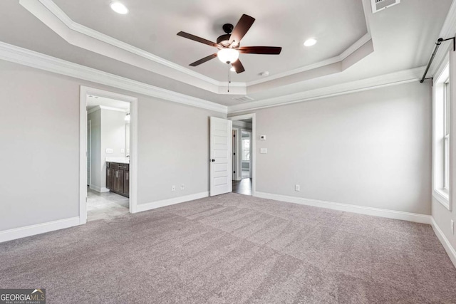 1824 Alberta Ln, Winder, GA 30680 - unfurnished bedroom with a tray ceiling, light carpet, crown molding, recessed lighting, and multiple windows