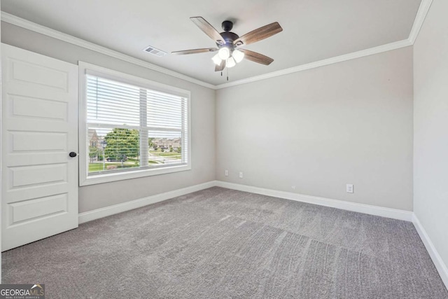 1824 Alberta Ln, Winder, GA 30680 - empty room with ceiling fan, carpet floors, baseboards, and crown molding