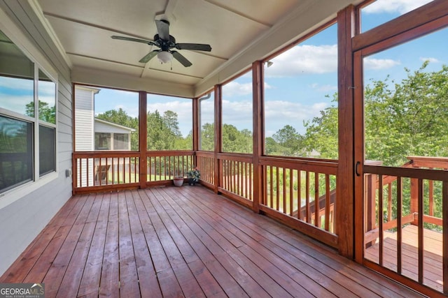 1824 Alberta Ln, Winder, GA 30680 - wooden deck featuring a ceiling fan and a sunroom