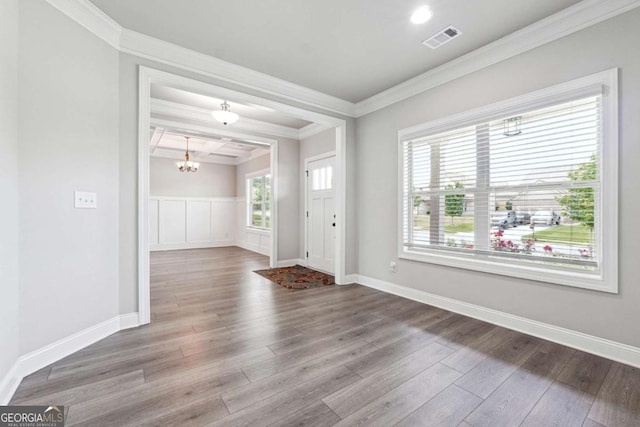1824 Alberta Ln, Winder, GA 30680 - entrance foyer featuring a chandelier, crown molding, wood finished floors, and baseboards