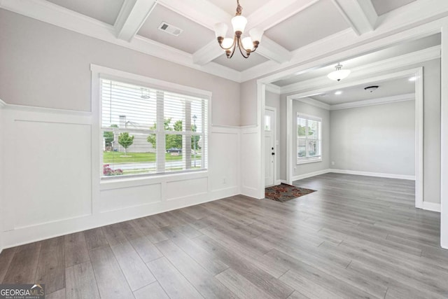 1824 Alberta Ln, Winder, GA 30680 - interior space with a chandelier, coffered ceiling, wood finished floors, beam ceiling, and a decorative wall