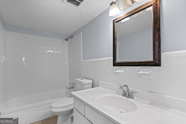 3626 Buford Hwy Unit C1, Brookhaven, GA 30329 - full bath with vanity, washtub / shower combination, a textured ceiling, tile walls, and a wainscoted wall