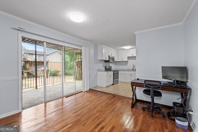 3626 Buford Hwy Unit C1, Brookhaven, GA 30329 - office area featuring ornamental molding, light wood-style flooring, and a textured ceiling