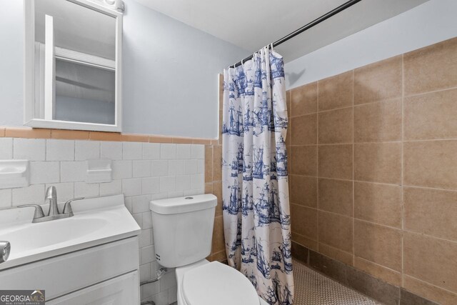 3626 Buford Hwy Unit C1, Brookhaven, GA 30329 - full bath featuring tiled shower, tile walls, vanity, and wainscoting