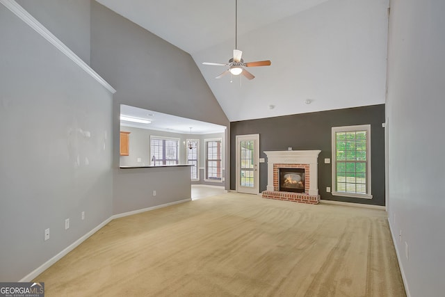 85 Parks Pl, Sharpsburg, GA 30277 - unfurnished living room featuring high vaulted ceiling, a ceiling fan, light carpet, baseboards, and a brick fireplace