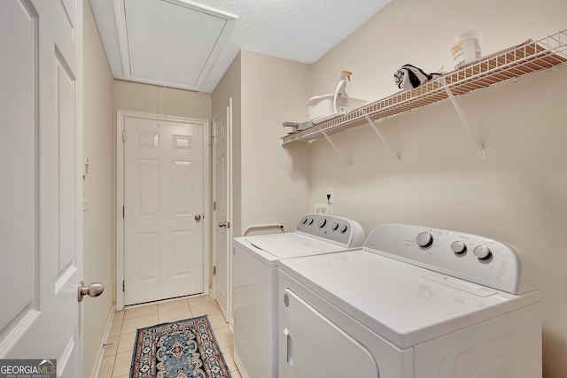 85 Parks Pl, Sharpsburg, GA 30277 - laundry room featuring attic access, independent washer and dryer, light tile patterned floors, and a textured ceiling