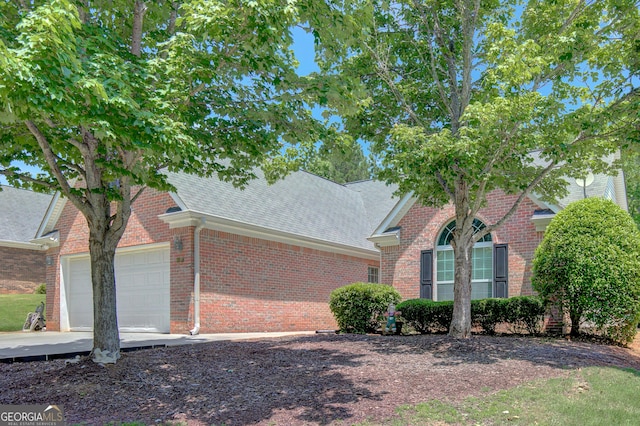 85 Parks Pl, Sharpsburg, GA 30277 - view of front of property with a shingled roof, a garage, and brick siding