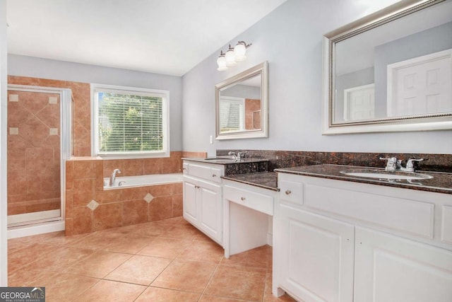 2023 Arbor Springs Way, Buford, GA 30519 - bathroom with double vanity, tile patterned floors, a garden tub, and a stall shower