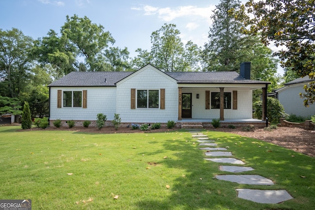 215 Holman Ave, Athens, GA 30606 - modern farmhouse style home featuring covered porch, a chimney, a front lawn, and roof with shingles