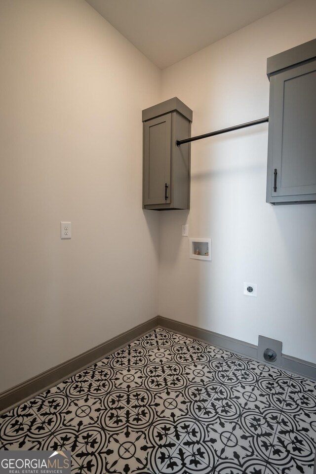 215 Holman Ave, Athens, GA 30606 - washroom featuring electric dryer hookup, cabinet space, baseboards, and hookup for a washing machine