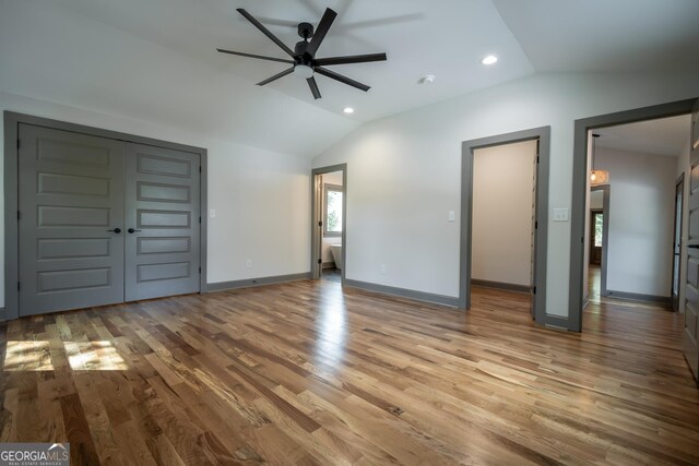 215 Holman Ave, Athens, GA 30606 - unfurnished bedroom featuring lofted ceiling, wood finished floors, recessed lighting, baseboards, and ceiling fan