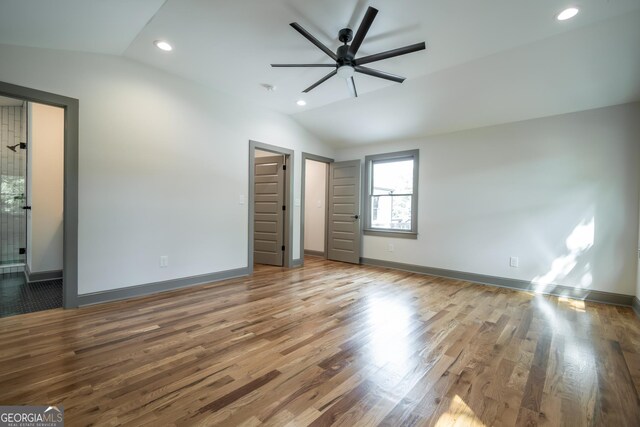 215 Holman Ave, Athens, GA 30606 - unfurnished bedroom featuring vaulted ceiling, wood finished floors, baseboards, recessed lighting, and ceiling fan