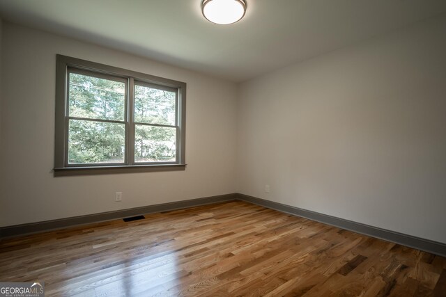 215 Holman Ave, Athens, GA 30606 - spare room with wood finished floors and baseboards