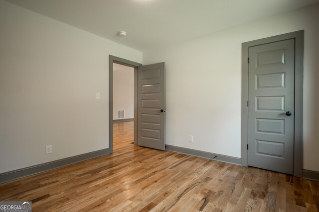 215 Holman Ave, Athens, GA 30606 - unfurnished room featuring light wood-type flooring and baseboards