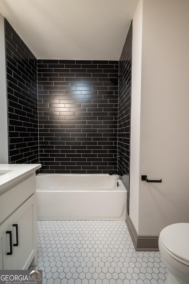 215 Holman Ave, Athens, GA 30606 - bathroom featuring toilet, vanity, shower / bath combination, and baseboards