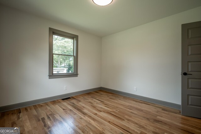 215 Holman Ave, Athens, GA 30606 - empty room with wood finished floors and baseboards
