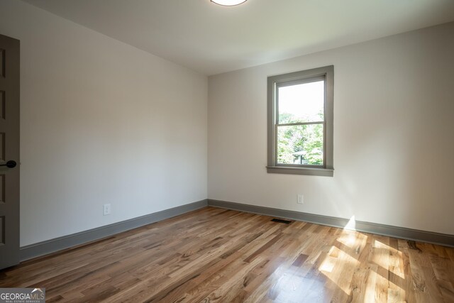 215 Holman Ave, Athens, GA 30606 - empty room featuring wood finished floors and baseboards