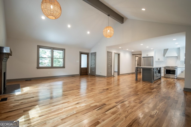 215 Holman Ave, Athens, GA 30606 - unfurnished living room featuring high vaulted ceiling, beamed ceiling, light wood-type flooring, a fireplace with flush hearth, and recessed lighting