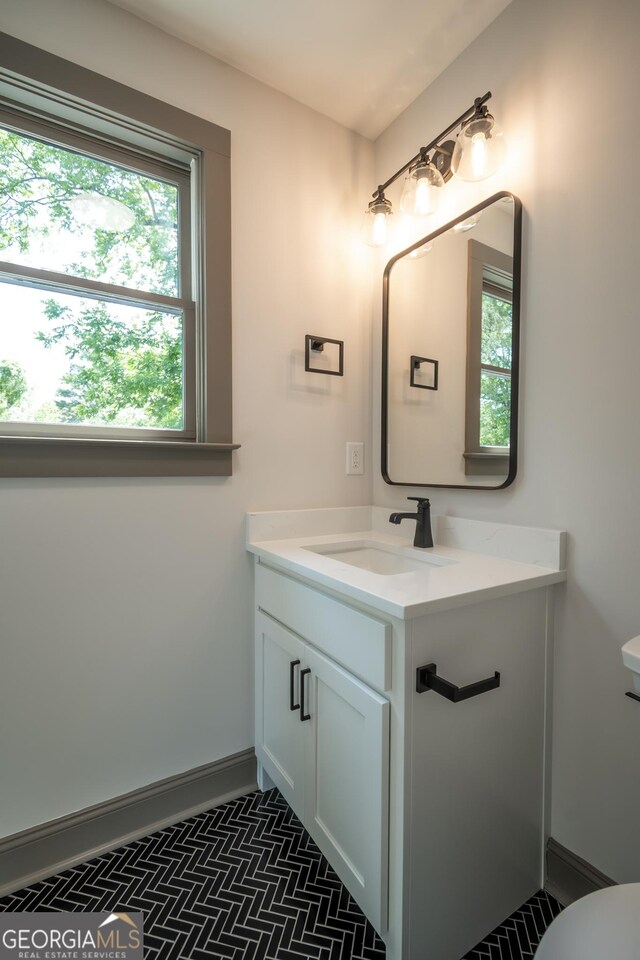 215 Holman Ave, Athens, GA 30606 - bathroom with vanity, toilet, and plenty of natural light