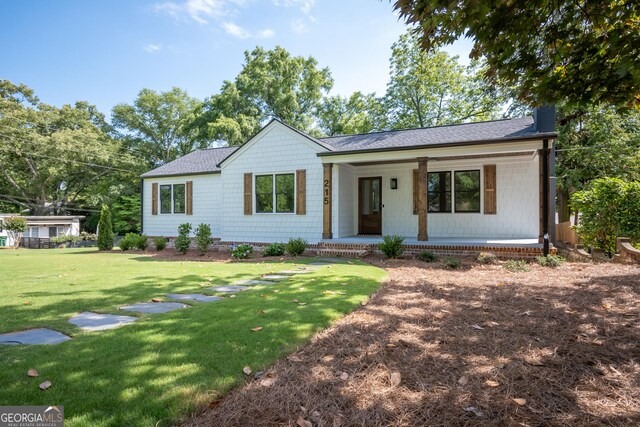 215 Holman Ave, Athens, GA 30606 - single story home with covered porch, a front lawn, and roof with shingles