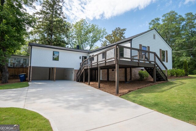 215 Holman Ave, Athens, GA 30606 - view of front of house with stairs, driveway, a front lawn, and a garage
