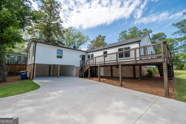 215 Holman Ave, Athens, GA 30606 - back of property featuring stairway, a carport, a deck, and driveway