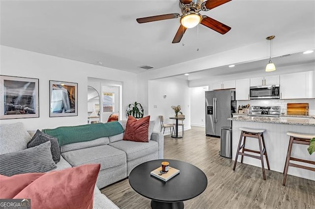 2912 Palm Dr, East Point, GA 30344 - living room with light wood-style flooring, a ceiling fan, and recessed lighting