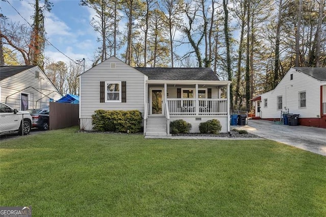 2912 Palm Dr, East Point, GA 30344 - view of front of property with a porch, a front yard, and roof with shingles