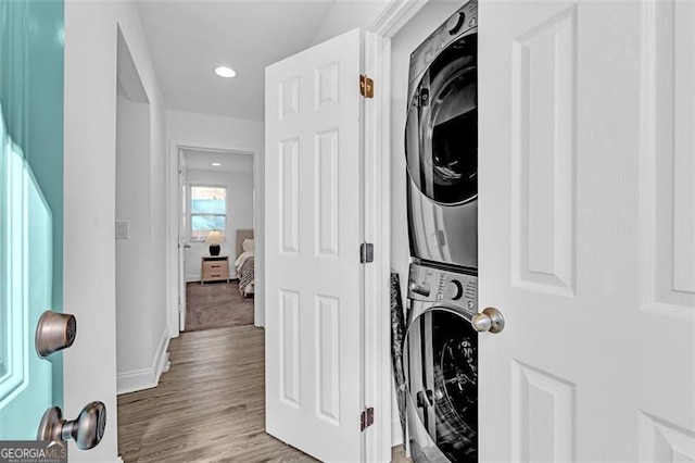 2912 Palm Dr, East Point, GA 30344 - laundry room featuring estacked washer and dryer, light wood-style flooring, recessed lighting, and baseboards